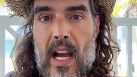 Russell Brand gets VIP treatment after flying first class from the US back to Britain to appear in court over charges
