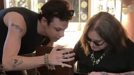 Ozzy Osbourne kisses rock star Yungblud after receiving touching retirement gift