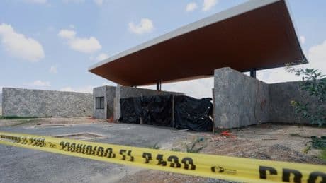 Mystery as authorities find mass grave with dozens of bodies in bags