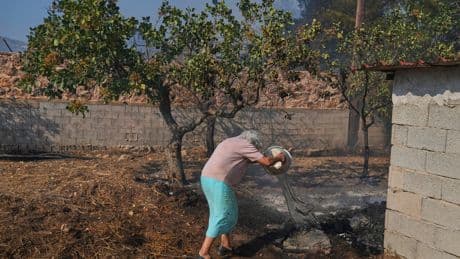Photos of burning wildfires in Greece