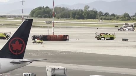 Fuel tanker flips on side at Vancouver airport, injuring driver