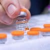 FDA requires updated warning about rare heart risk with COVID shots