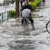 Sudden deluge of rain floods some streets and halts air and rail traffic in Tokyo