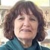 Divorced 'love rival', 69, of Brit expat found brutally murdered in French village is 'innocent' and 'devastated' by the crime, her brother insists after she was arrested then released without charge