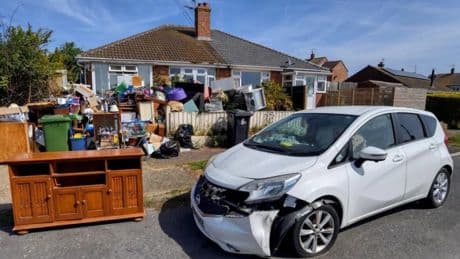 Homeowner with mountain of festering rubbish piling up in her garden is threatened with ‘direct action’