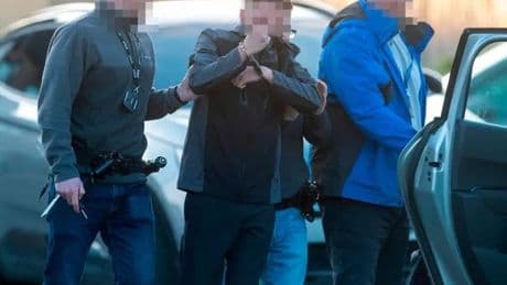 Glasgow police armed with chainsaws smash into home during dawn raids