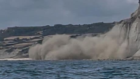 Moment cliff collapses in front of startled kayaker captured on camera