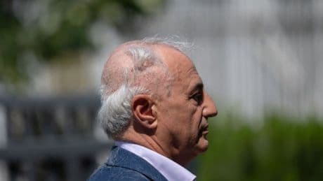 Lawyer shaves his head in protest but misses a spot