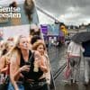 Laatste dag van de Gentse Feesten aan de gang, regenbui trekt over de stad