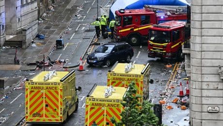 Man arrested after car hits crowd celebrating Liverpool's soccer trophy