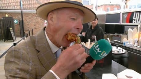 ITV Racing presenter STEALS reveller’s Guinness live on TV after trying hottest chicken wings in UK