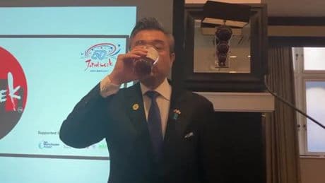 Japanese ambassador cheered on by pub crowd as he downs pint of bitter in Manchester