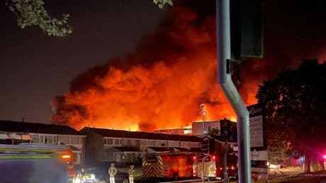 Huge fire engulfs abandoned college used as BBC filming location with plumes of black smoke seen across city