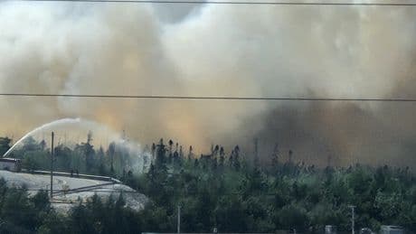 Firefighters continue to battle out-of-control wildfire in Halifax business park