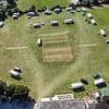 Fury as travellers 'break in' to cricket club before camping on the pitch and 'throwing rocks' at passers-by