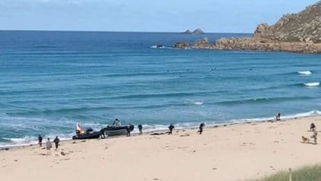Drugs gang are chased onto Cornwall beach in front of stunned tourists