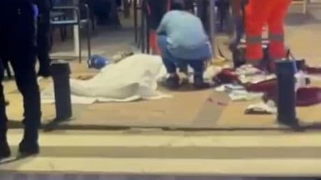 Body of slain gangster Eddie Lyons filmed lying outside bar in Spain as woman battles to save him