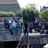 The queue for Dover? Pictures show large group of men idling by notorious French people smuggling port as UK little boat arrivals pass 50,000 since Labour swept to power last year