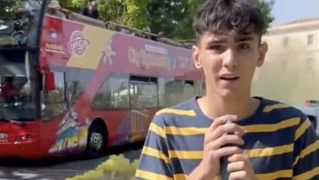 Moment anti-tourist protesters in Spain 'hold up' sightseeing bus and set off flare