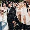 Blushing bride Daisy Lowe cradles daughter Ivy as she walks down the aisle with new husband Jordan Saul in striking wedding snaps
