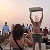 Outrage in Greece as 'disrespectful' tourist lifts up ancient marble to pose for photos at famed island temple