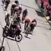 Shocking moment cycle race ends in disaster when police motorcyclist rides across sprint finish, sparking huge crash