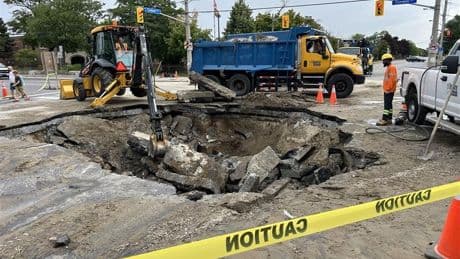 Sinkhole opens at busy Toronto intersection, leading to basement flooding