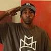 50 Cent's rapper friend Bang Em Smurf is staying in a taxpayer-funded UK asylum hotel - after being jailed over a shootout in the US