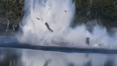 Helicopter tackling forest fire crashes into lake while scooping water