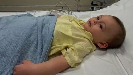 Erin McNaught and Stace Cadet share heartache as seven month old son diagnosed with brain tumour