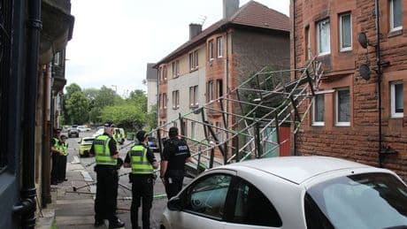 Scaffolding collapses and smashes window after falling into building on Scots street