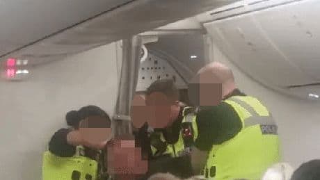 Moment ‘drunk’ passenger hauled off TUI flight by cops after PUNCHING cabin crew & screaming ‘plane’s going to crash’