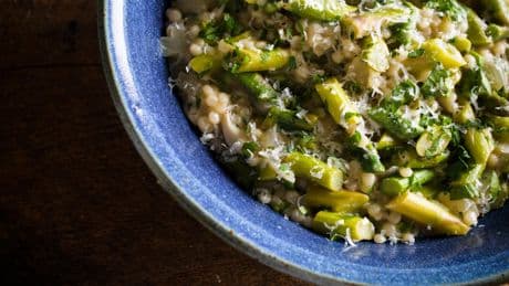 Couscous gets the risotto treatment in this creamy springtime recipe