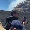 Dramatic new footage shows tourists on Mount Etna running for their lives as ash pours from volcano's crater… while others stop to take pictures of explosion
