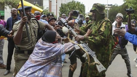 Kenyan police officer arrested after daylong protests over a blogger's death in custody
