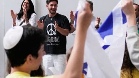 Feted by school children, tossing out a first pitch: Former Israeli hostage grapples with celebrity