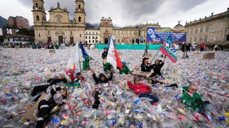 Colombian waste pickers inundate iconic Bogota square with plastic bottles to protest falling wages