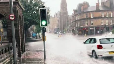 Sudden storm hits major UK city as bus battles through flooded roads