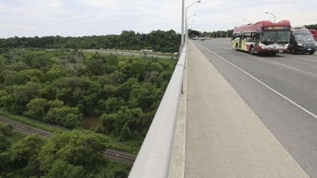 A man died when a pedestrian fell on his car from bridge over Toronto highway. The city says it's not to blame