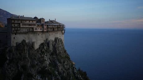 AP PHOTOS: Orthodox monks carry on a tradition of monastic life at a cliffside Greek monastery