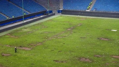 Shock pics show horror aftermath of Bundesliga pitch invasion that left 25 in hospital and fan fighting for their life