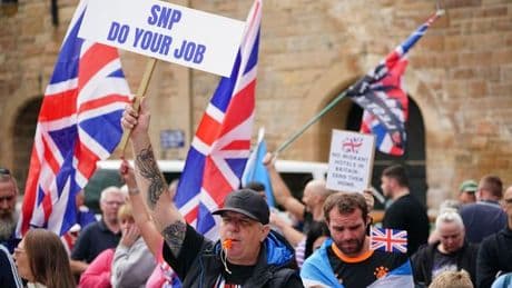 Protesters clash outside Scots asylum hotel as police work to manage crowds