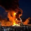 Moment controversial 'racist' bonfire with effigy of migrants in life jackets and a 'stop the boats' sign at the top is set alight