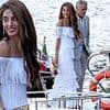 Amal Clooney, 47, wows in white with stunning fringed gown as she joins suave husband George, 64, and pals for dinner on a boat in Lake Como