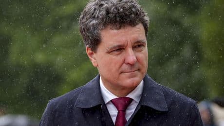 Romania's new president is sworn in as a political crisis eases, but challenges loom
