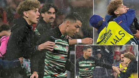 Cristiano Ronaldo grabbed by pitch invader ahead of Portugal's clash with Germany - as stewards are forced to step in after security breach