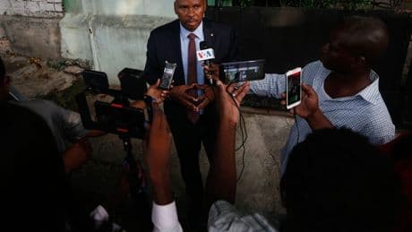 Haitian police arrest a former senator accused of working with gangs to attack a peaceful community