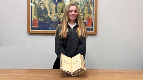 Scots schoolgirl related to Robert Burns examines book he gifted to ancestor