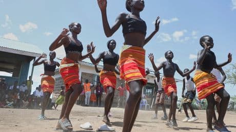 Fusion between culture and modernity as children dance in Kenya’s refugee camp