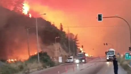 Tourists evacuated in Greece heatwave and three people die as wildfires spread